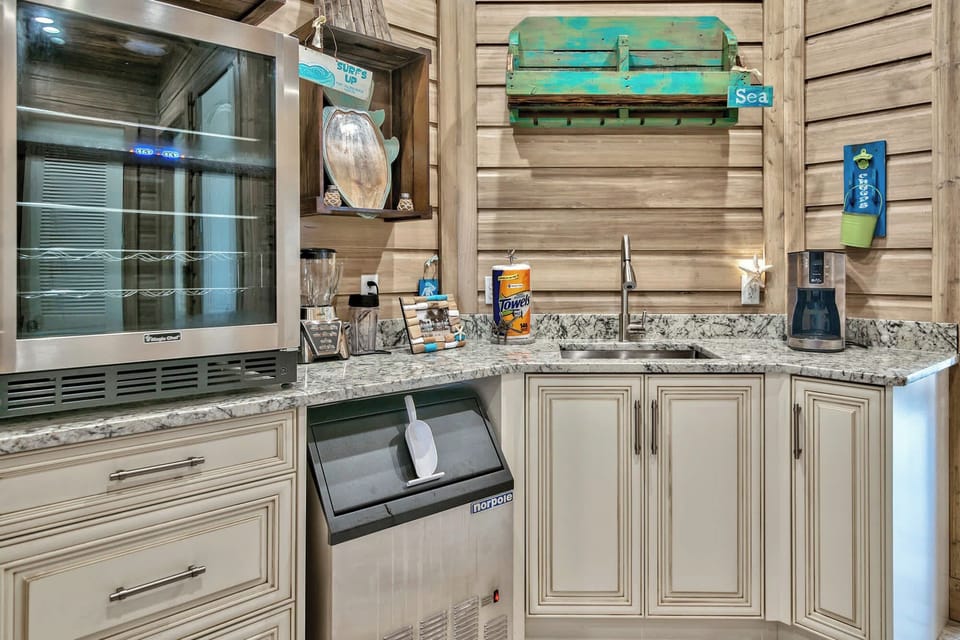 Compact kitchenette w/ cabinets, sink, and everything close at hand