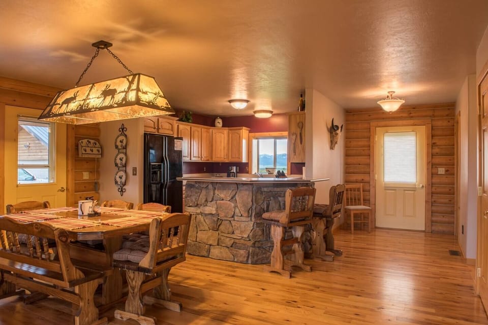 The open kitchen allows for plenty of room to cook, enjoy meals, play board games, or plan your outdoor adventures.
