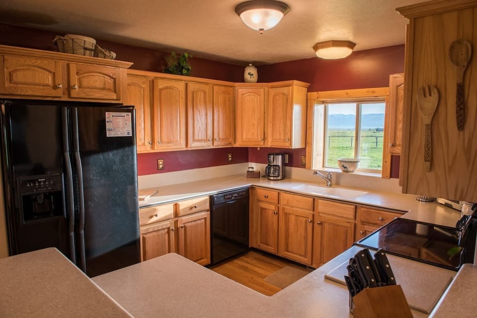 The kitchen not only provides a beautiful view of nature, but plenty of space for cooking and baking.