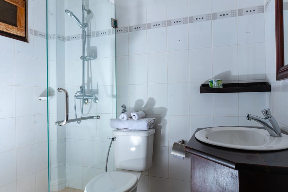Shower, free toiletries, slippers, towels