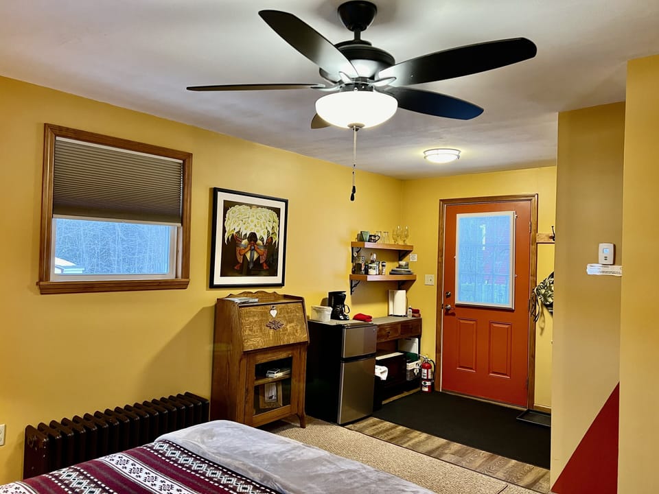 Secretary's desk for dedicated work space and amply supplied kitchenette.