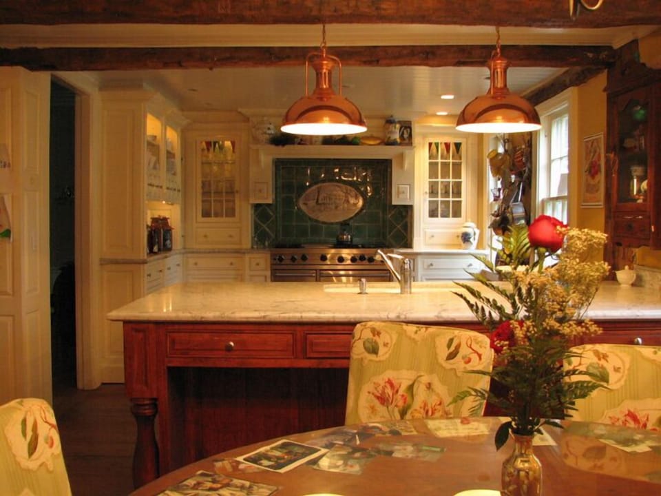 Gourmet Kitchen features  custom cabinetry
 with  original expose beams