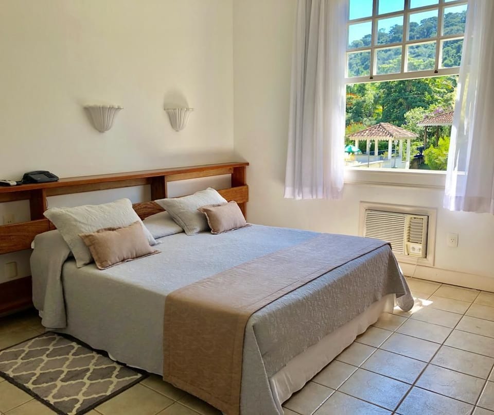 Quarto quadruplo standard, Acessível, Vista para o jardim | 5 bedrooms, minibar, desk, blackout drapes