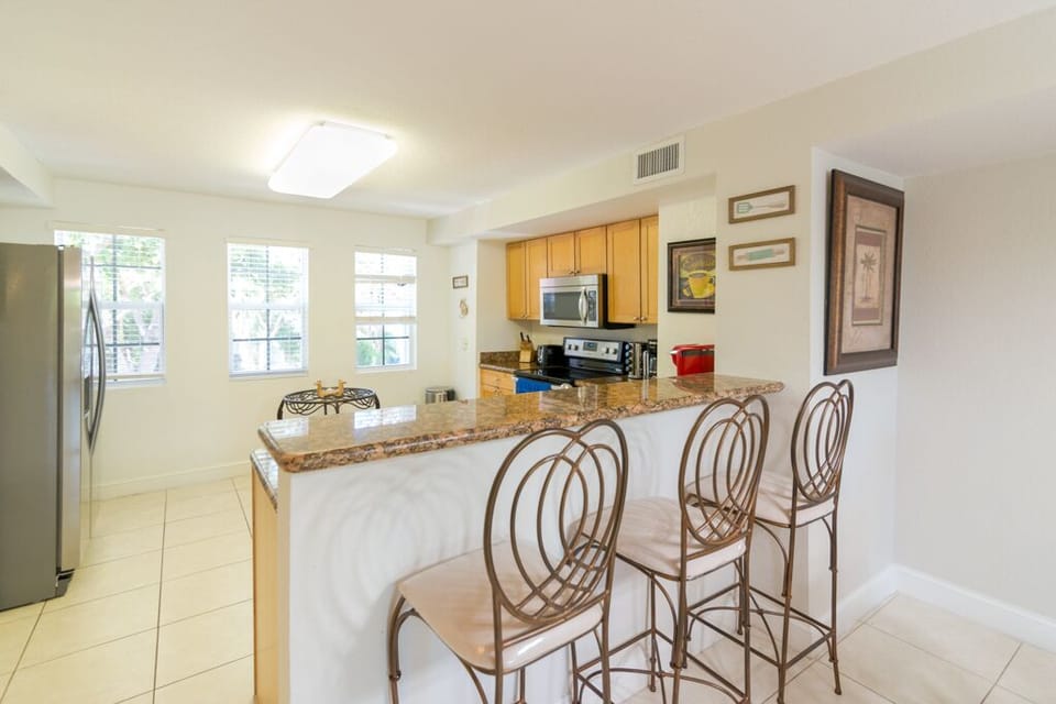 2nd floor full kitchen is located next to center island & close to all the fun.