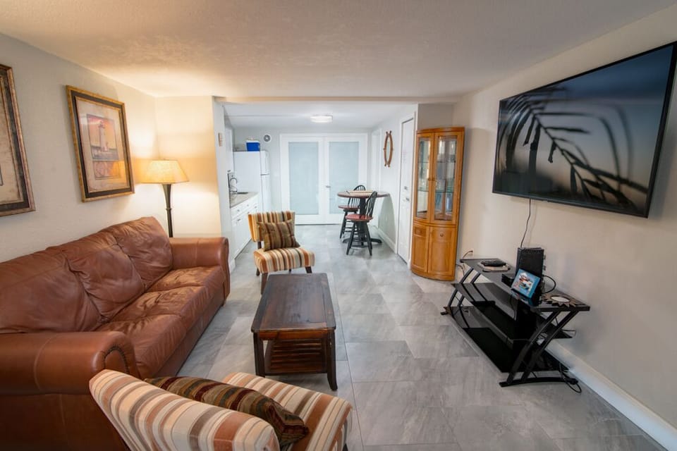 1st floor livingroom or 4th bedroom w/ awesome sofa-bed and 65" smart TV