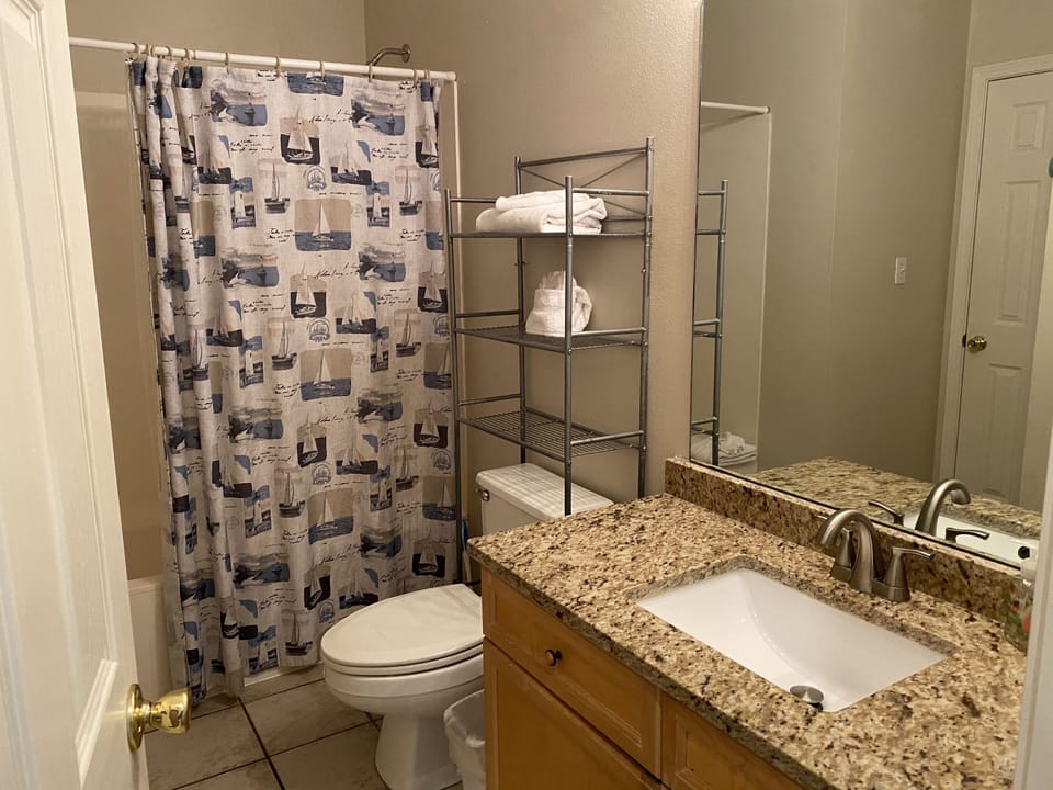 Full bathroom on the main floor with granite countertops and shower/tub!