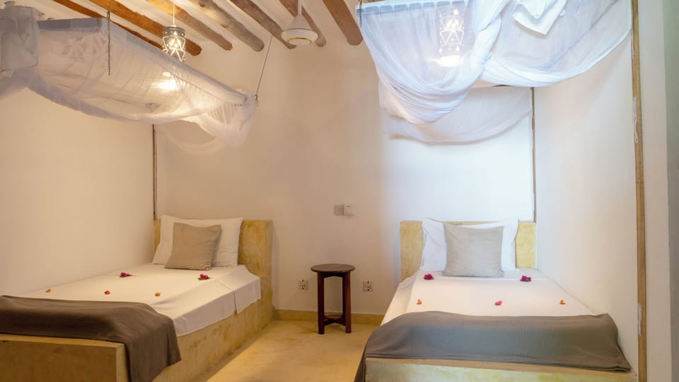 Family Suite, 2 Bedrooms, Ocean View | In-room safe, bed sheets
