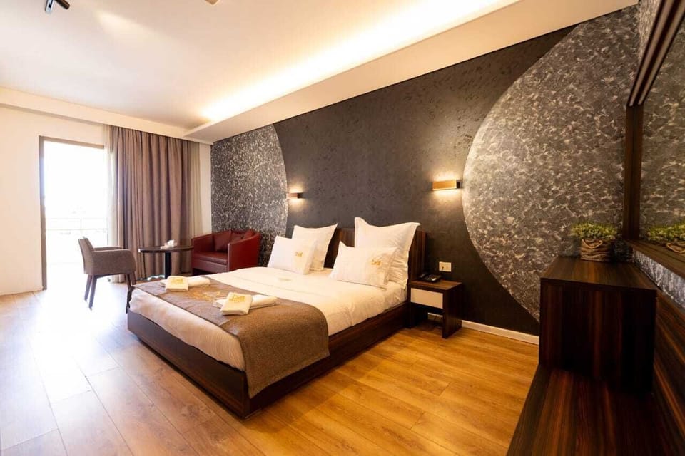 Superior Double Room | Minibar, in-room safe, desk, blackout drapes