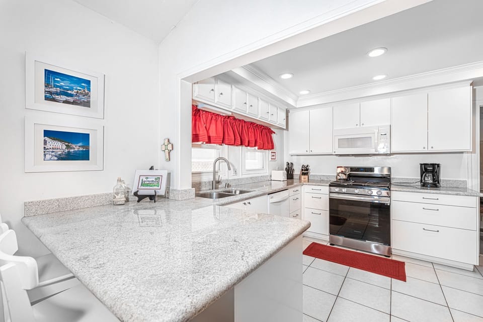 The kitchen comes stocked with dishes, utensils, cookware, bakeware, and large and small appliances.
                