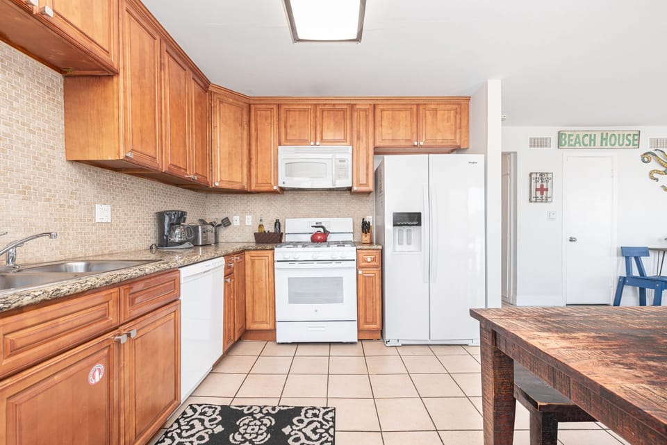 The kitchen flows seamlessly into the dining area, creating a welcoming, social setting for effortless meal prep and gathering
                