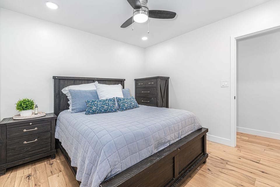 Guest Bedroom 2 includes a queen-size bed.
                