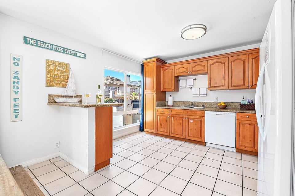 Kitchen with coastal decor and convenient essentials
                