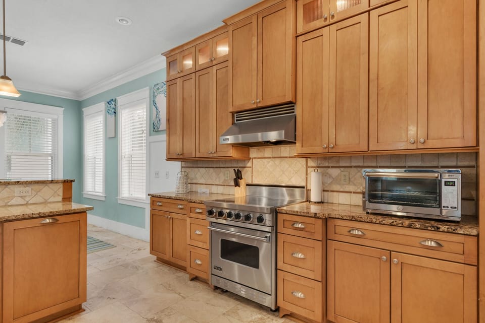 Granite counters, Viking range, stainless appliances, tons of custom cabinets. 