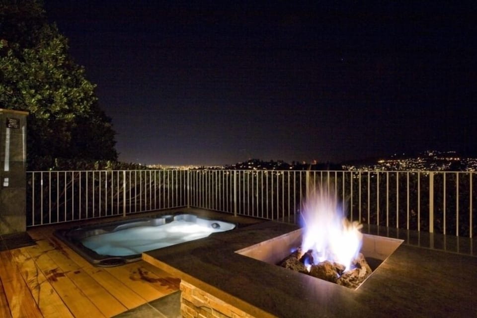 Fire pit, hot tub and shower with San Francisco skyline.