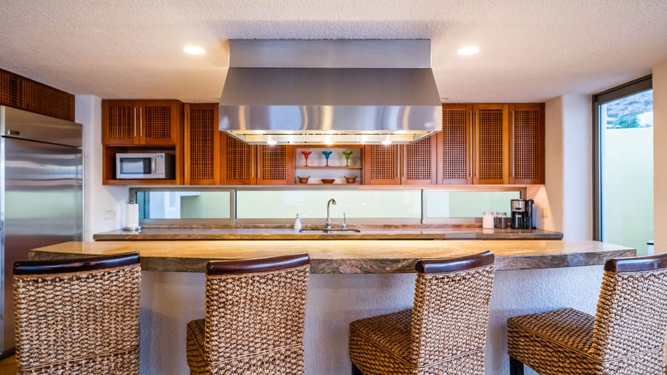 Professional kitchen with Viking range, Mongram fridge and granite counter-tops.