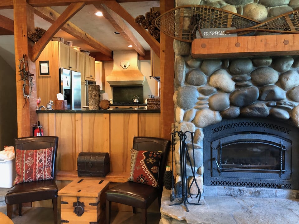 Fireplace and looking through to kitchen.