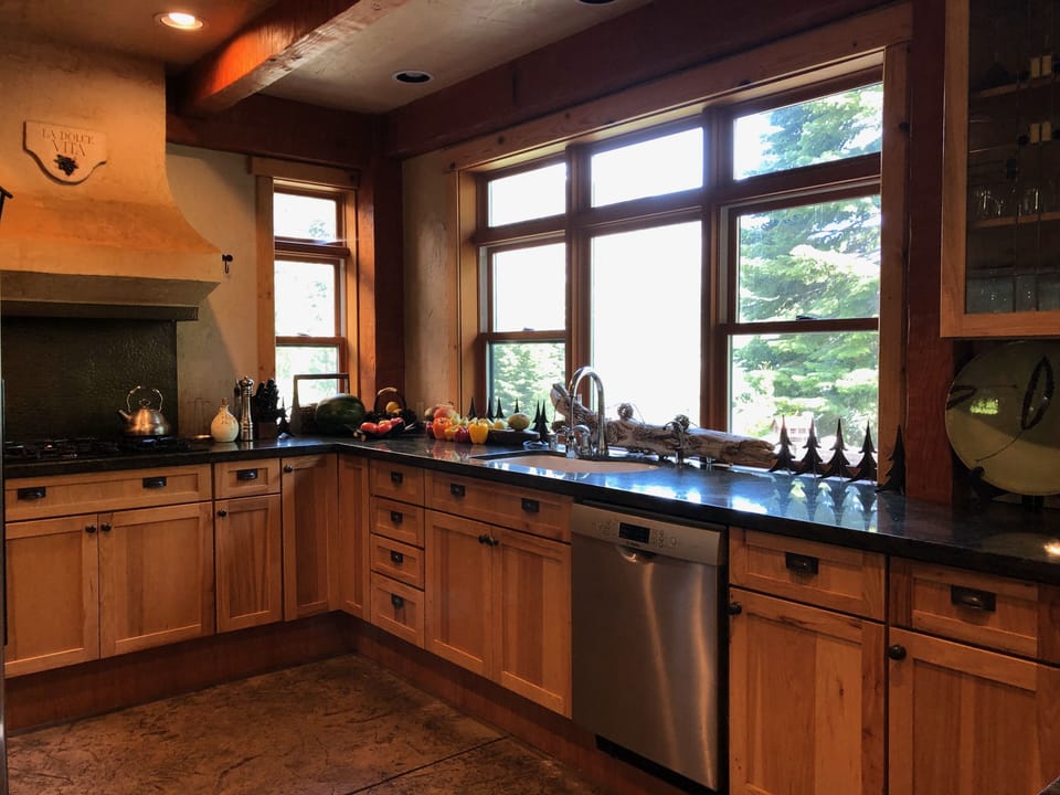 Kitchen with stainless appliances and granite counter tops.