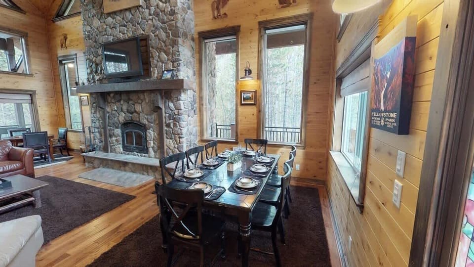 A full size dining table that seats up to 8 people. Additional seating is available at another table and the kitchen island.