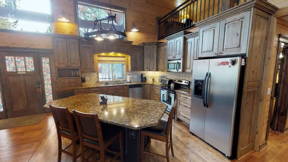 A full size kitchen with appliances, cookware, dishes, utensils, and everything you might need to cook a home cooked meal. Just bring your own food.