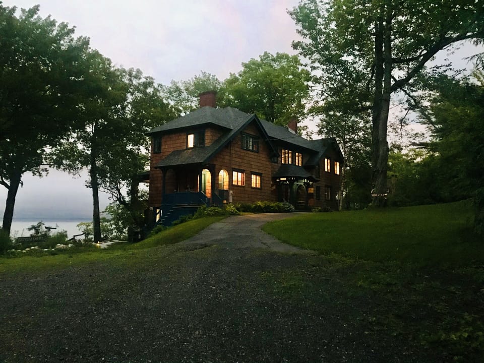 The house at dusk is a beacon of light. 