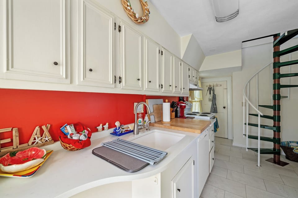 Kitchen and stairs to bedroom and bath