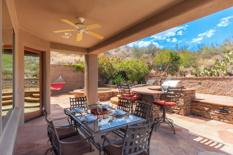 Backyard patio with bar, BBQ, and desert views
