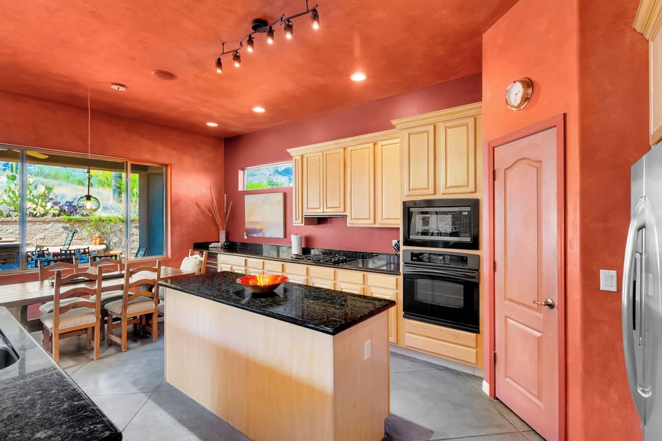 Expansive open kitchen with dining space and walk-in pantry