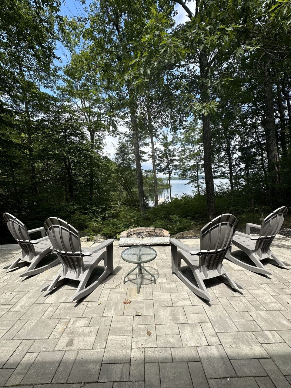 Patio with firepit overlooking Togus Pond