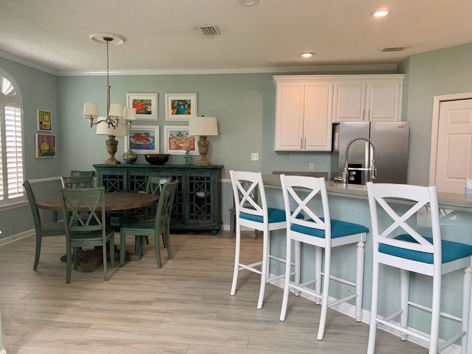 Dining table and bar seating.  Additional seating for four on patio