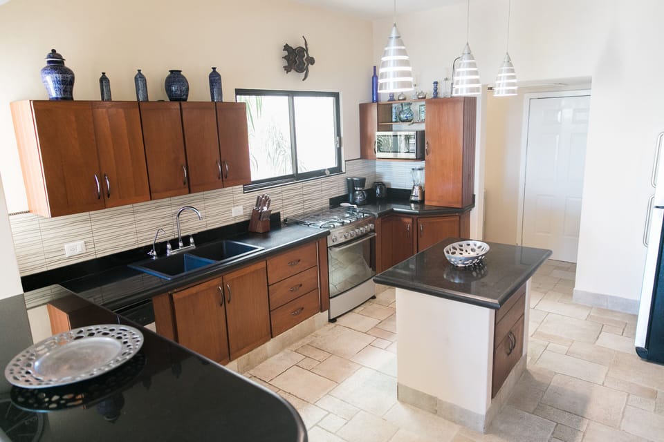 Kitchen with laundry room beyond.