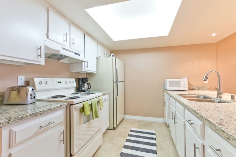 The spacious kitchen offers plenty of counter space for preparing your favorite meals.