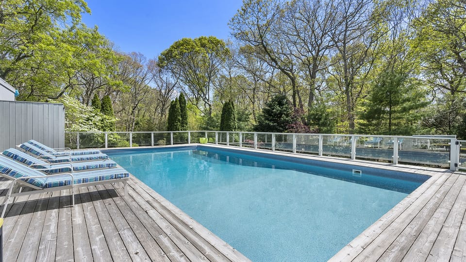 4 sun loungers on raised deck
