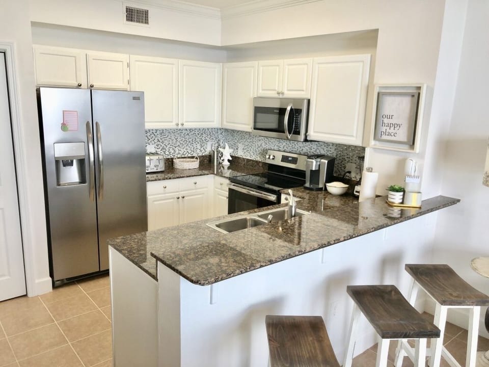 Kitchen also includes a Kuerig coffee maker, toaster, blender and can opener.