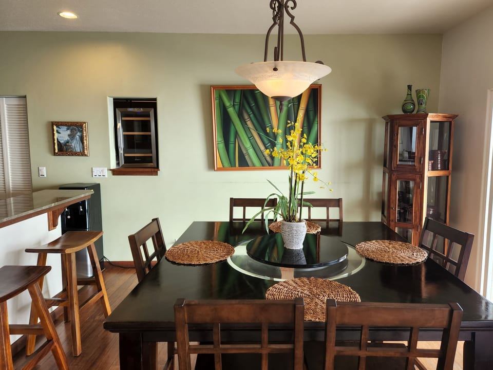 Dining table indoors seats 6, plus 3 at breakfast bar. Outdoor lanai dining 8