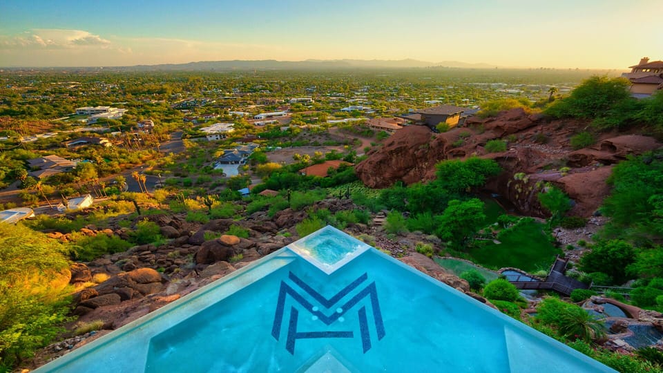 Birds eye view of saltwater pool & spa overlooking the valley during the day