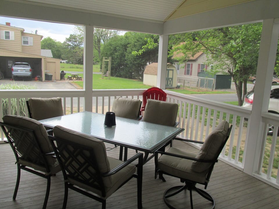 Take your evening meals on the enclosed deck, fan for hot day, eating for 6
