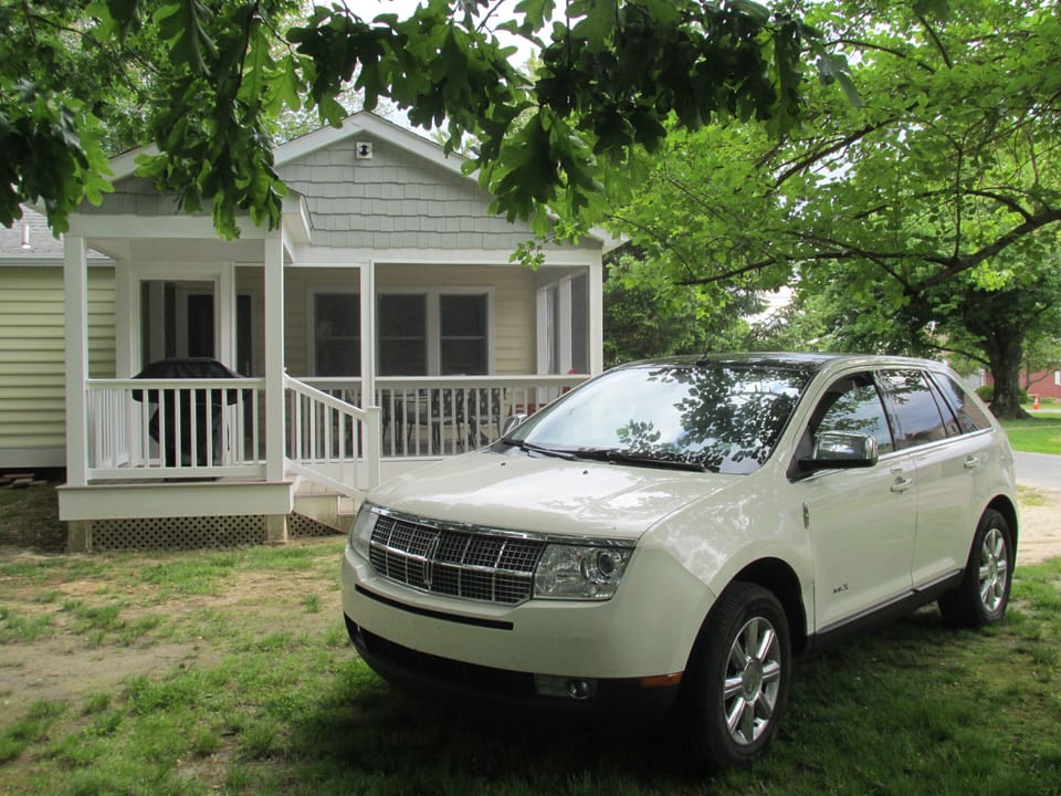 Park in read of cottage off Caroline Ave.