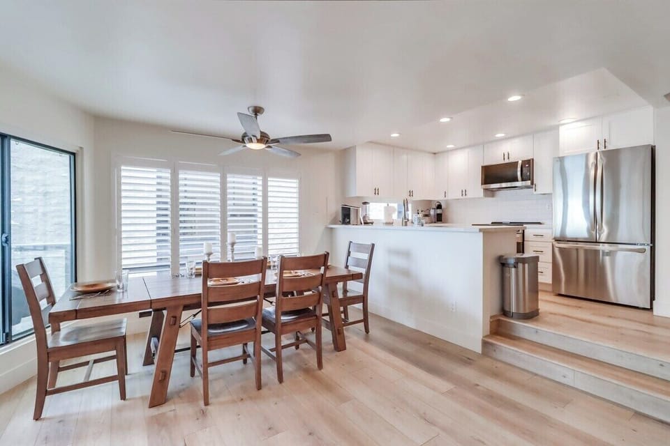 Dining just off of the kitchen, table seating for 6 with bright windows with adjustable blinds