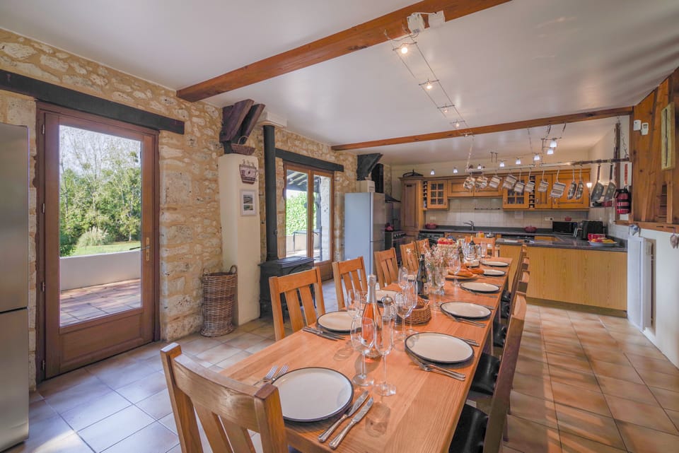 Huge kitchen and dining area with French doors onto a large dining terrace 