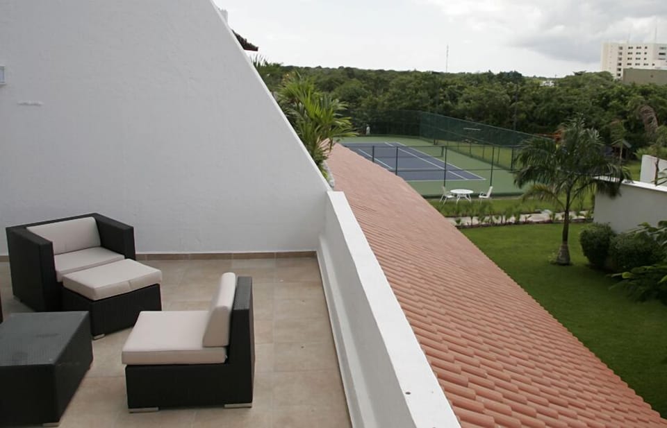 The terrace also has a view of the gardens and the tennis court