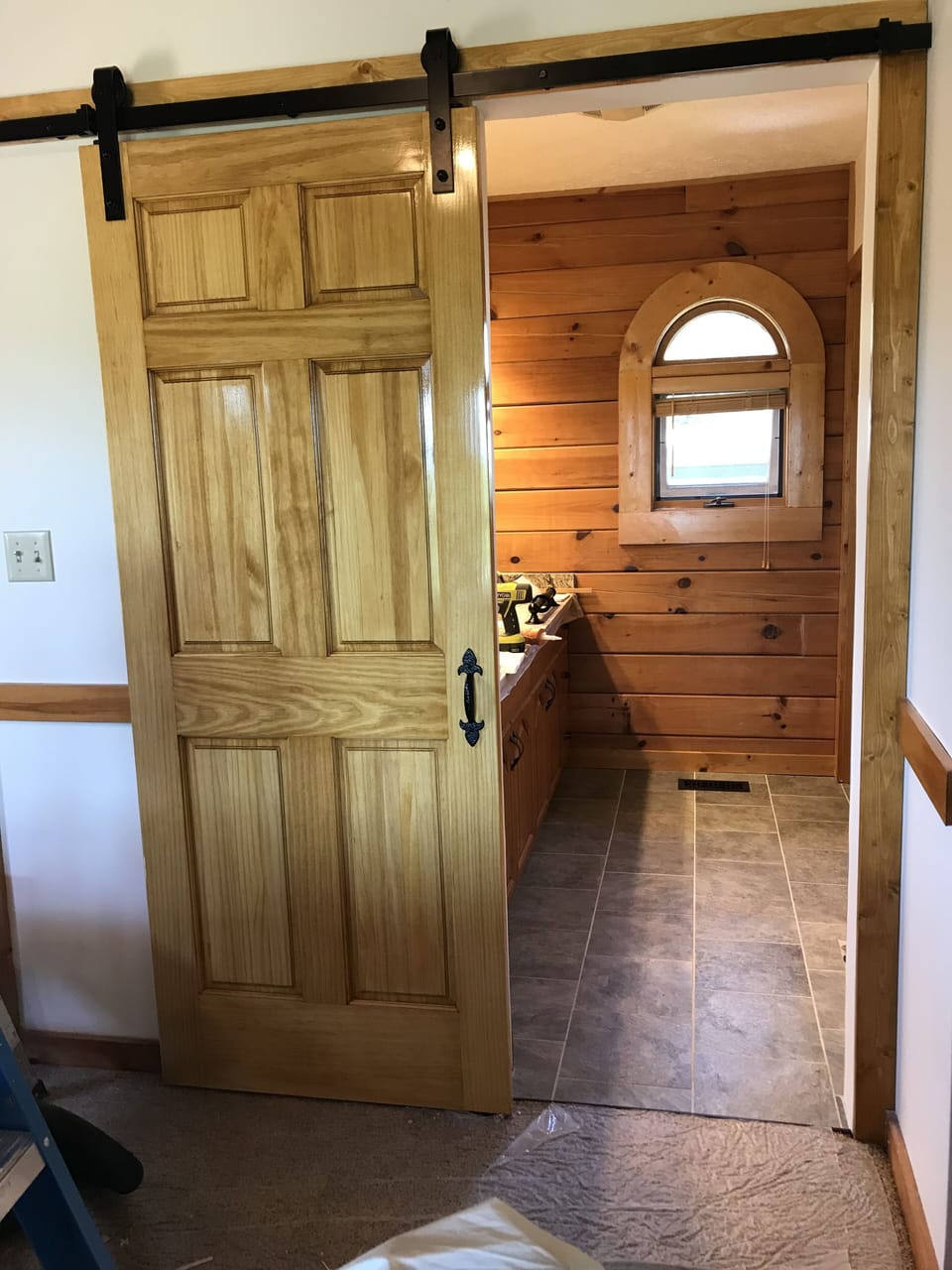 Sliding "barn" door separates the master bedroom from the en suite. (2018)