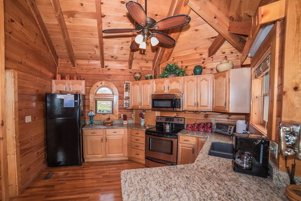 Kitchen from dining room.  Love the leather finished granite!