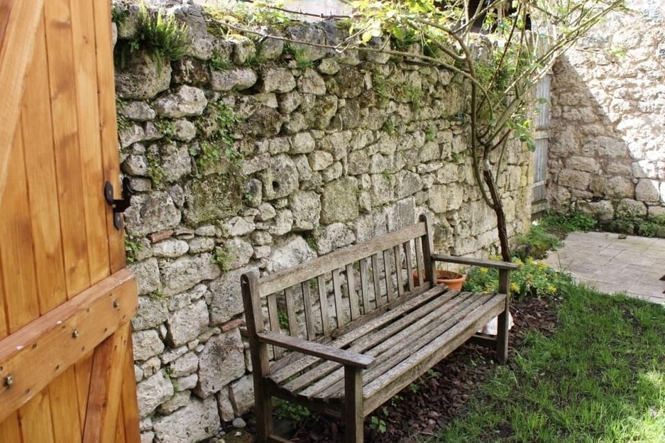 Walled, grassy courtyard is an oasis of green in this medieval village.