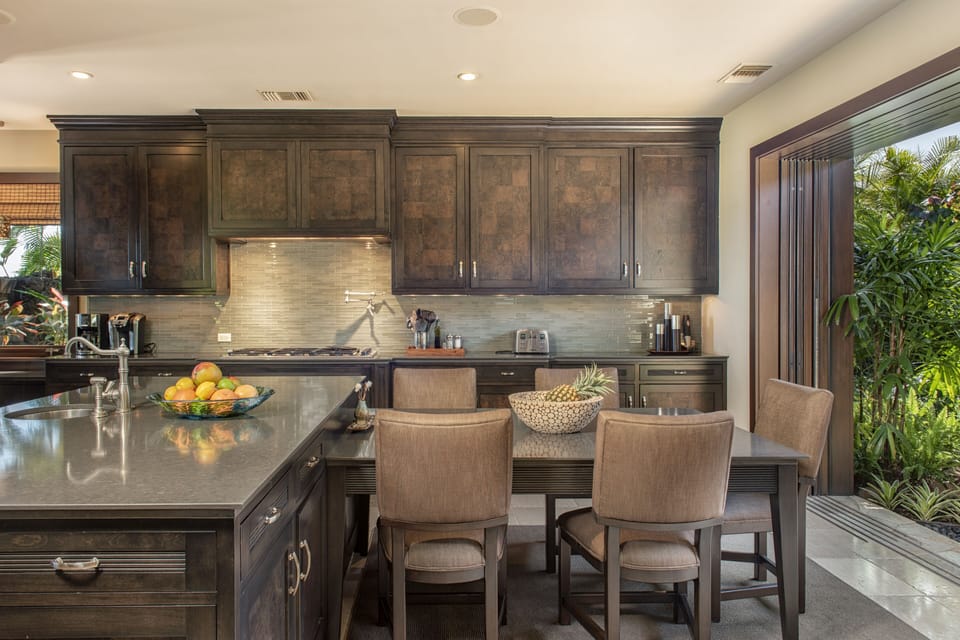 FULLY EQUIPPED CHEF'S KITCHEN WITH HIGH-END APPLIANCES AND CHEF'S TABLE.