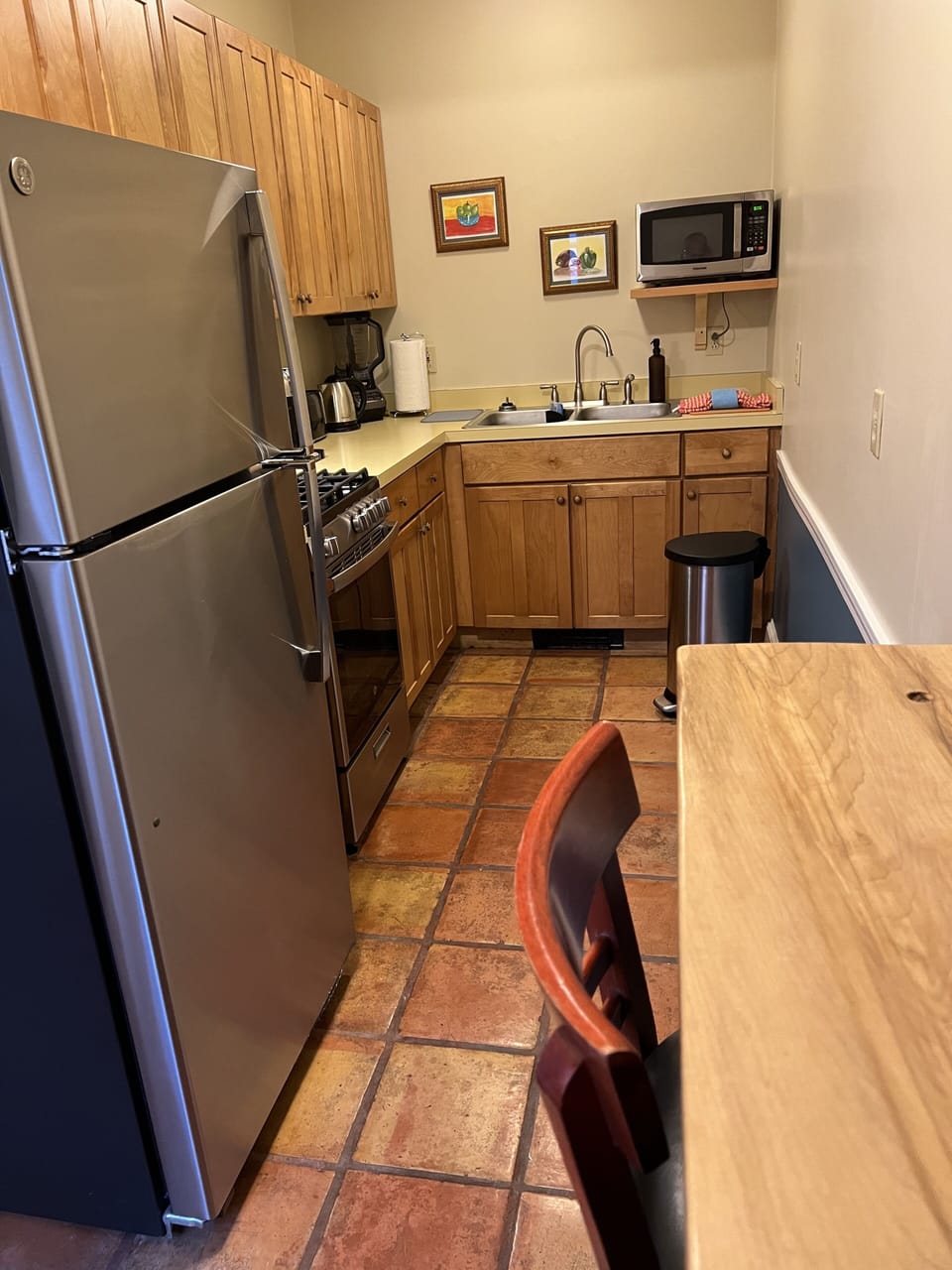 A full kitchen stocked with all the appliances needed to prepare meals at home.