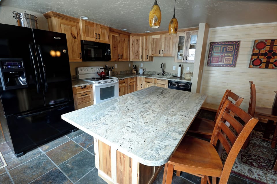 Updated kitchen with large island for family style meals.