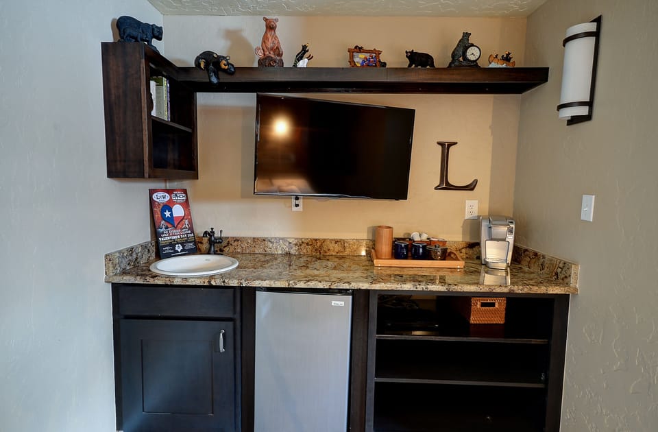 Master suite (lower level) includes tv, coffee service, hand sink & mini-fridge.