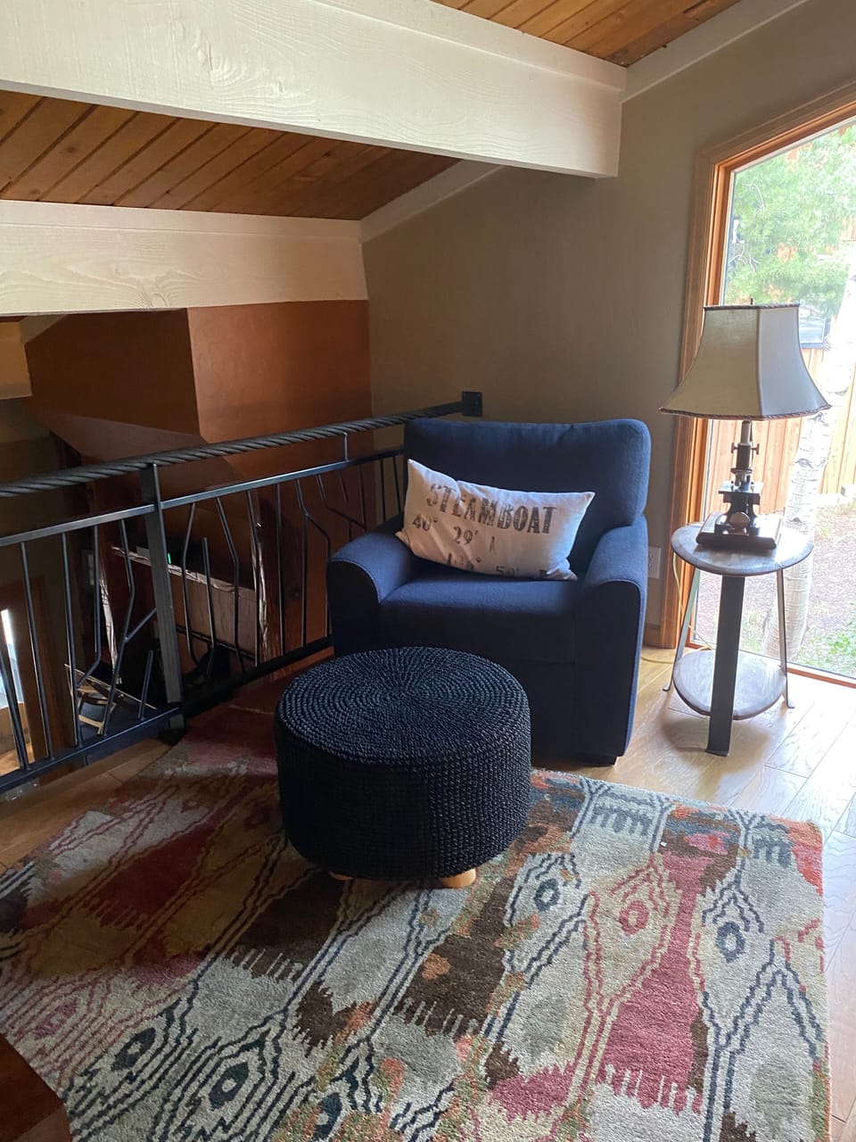 A second view of the loft, this chair is sitting opposite to the couch. 