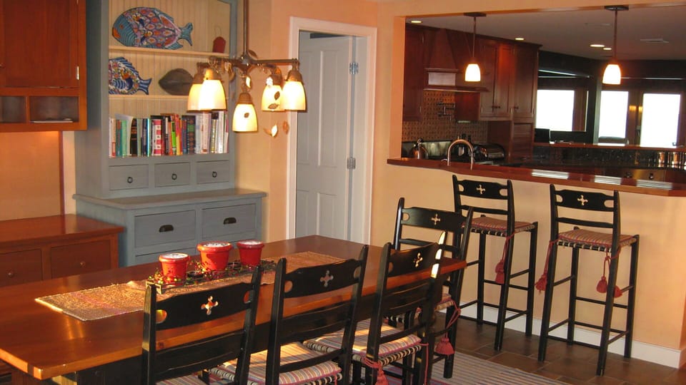Dine in the kitchen table area w/walk-in pantry (2nd refrigerator) behind door.