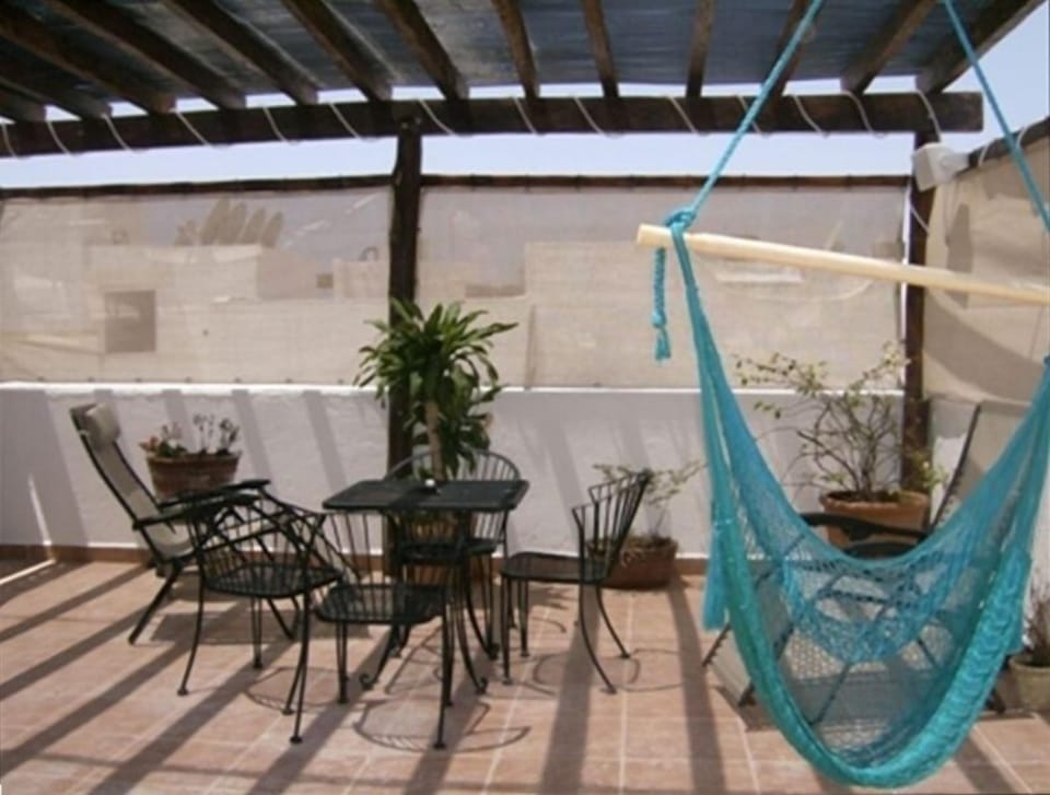 Lounge area with pergola and hammock
